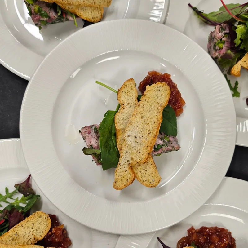 Hamhock terrine, salad leaves, Tomato & gherkin chutney, Bread crisps
